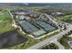 Community tennis courts and clubhouse with pool and water feature in an aerial view at 18028 Gawthrop Dr # 406, Bradenton, FL 34211