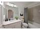 Clean bathroom featuring a white vanity, a large mirror, and a shower-tub combo with neutral tile at 18028 Gawthrop Dr # 406, Bradenton, FL 34211
