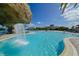 Resort-style pool with a rock waterfall feature and ample seating, perfect for relaxation at 18028 Gawthrop Dr # 406, Bradenton, FL 34211