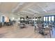 Large dining room with wood floors, modern tables, chairs, and elegant decor at 18028 Gawthrop Dr # 406, Bradenton, FL 34211
