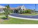 Exterior shot of the clubhouse with well-maintained landscaping, circular driveway, and covered entrance at 18028 Gawthrop Dr # 406, Bradenton, FL 34211