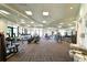 Bright, spacious gym with modern exercise equipment and large windows for natural light at 18028 Gawthrop Dr # 406, Bradenton, FL 34211