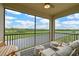 Relaxing screened lanai featuring comfortable seating and picturesque views of the lush golf course at 18028 Gawthrop Dr # 406, Bradenton, FL 34211