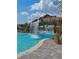 A stunning pool featuring a rock waterfall and plenty of seating at 18028 Gawthrop Dr # 406, Bradenton, FL 34211