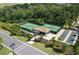 Aerial view of community tennis and bocce ball courts with a covered seating area at 18028 Gawthrop Dr # 406, Bradenton, FL 34211
