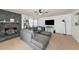 Living room featuring fireplace, ceiling fan, carpet flooring and sectional sofa at 1808 25Th E Ave, Bradenton, FL 34208