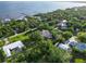 Beautiful aerial view of a neighborhood with lush greenery and homes near a body of water, offering a tranquil lifestyle at 1860 Citron St, Punta Gorda, FL 33980