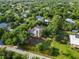 Aerial view of a residential area showcasing homes nestled among trees and landscaping, with a peaceful and private ambiance at 1860 Citron St, Punta Gorda, FL 33980