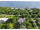 Wonderful overhead view of neighborhood homes with lake access and mature landscaping at 1860 Citron St, Punta Gorda, FL 33980