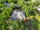 Aerial shot showcasing a well-maintained home with a screened-in pool and lush landscaping at 1860 Citron St, Punta Gorda, FL 33980