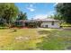 Spacious backyard with large, screened lanai and verdant landscaping creating a private retreat at 1860 Citron St, Punta Gorda, FL 33980