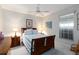 Cozy bedroom featuring a queen bed, two nightstands, and a ceiling fan at 1860 Citron St, Punta Gorda, FL 33980