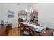 Dining room with wood table, seating for eight, and an elegant light fixture at 1860 Citron St, Punta Gorda, FL 33980
