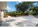 Long concrete driveway and lush landscaping creating a welcoming entrance to the property at 1860 Citron St, Punta Gorda, FL 33980