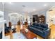 Bright living room with hardwood floors, fireplace, and furniture, offering ample seating and natural light at 1860 Citron St, Punta Gorda, FL 33980