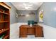 Home office with gray walls, white trim, and an executive desk at 1860 Citron St, Punta Gorda, FL 33980