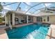 Large screened-in pool with attached spa and an outdoor entertainment area, a perfect retreat at 1860 Citron St, Punta Gorda, FL 33980