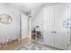 Bright bedroom with storage for toys, view to an adjacent bedroom and a double closet at 2017 Woodleaf Hammock Ct, Bradenton, FL 34211