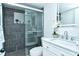 Beautiful bathroom featuring a glass-enclosed shower with gray tile and a vanity with a modern sink at 2227 Sunset Dr # E22, Bradenton, FL 34207