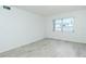 Bright, vacant bedroom with contemporary flooring and ample natural light from the window at 2227 Sunset Dr # E22, Bradenton, FL 34207