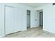 Bedroom with light floors, closet and access to another room with natural light at 2227 Sunset Dr # E22, Bradenton, FL 34207