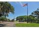 Historical park entrance with American and other flags, set against a blue sky at 2227 Sunset Dr # E22, Bradenton, FL 34207