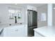 Charming kitchen with stainless steel appliances, white cabinetry, quartz countertop and subway tile backsplash at 2227 Sunset Dr # E22, Bradenton, FL 34207