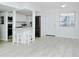 Well-lit kitchen featuring stainless steel appliances, quartz countertops, and modern white cabinets at 2227 Sunset Dr # E22, Bradenton, FL 34207