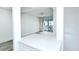 Bright, open-concept living room featuring modern flooring and a sliding glass door to the outdoor patio at 2227 Sunset Dr # E22, Bradenton, FL 34207