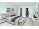 Inviting bedroom with stylish furnishings, a comfortable bed, and access to both the bath and laundry at 2227 Sunset Dr # E22, Bradenton, FL 34207
