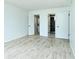 Spacious bedroom showing double doors to the bathroom and laundry room at 2227 Sunset Dr # E22, Bradenton, FL 34207