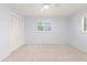 Bright bedroom with neutral carpet, ceiling fan, and large window at 2301 Arborfield Ln, Sarasota, FL 34235