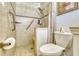 Accessible bathroom with tiled shower, grab bars, and modern fixtures at 2605 Sunnybrook Dr, Sarasota, FL 34239