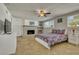 Bright bedroom with a brick fireplace and neutral tile flooring, creating a warm, inviting space at 2605 Sunnybrook Dr, Sarasota, FL 34239