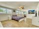Bright bedroom with mirrored closet and tile floor at 2605 Sunnybrook Dr, Sarasota, FL 34239