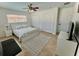 Comfortable bedroom featuring neutral color palette, and tile floors at 2605 Sunnybrook Dr, Sarasota, FL 34239