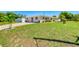 Well-manicured front yard and a paver driveway create great curb appeal for this beautiful single-story home at 2605 Sunnybrook Dr, Sarasota, FL 34239