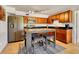 Eat-in kitchen features stainless steel appliances, granite countertops, and wood cabinetry at 2605 Sunnybrook Dr, Sarasota, FL 34239