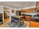 Updated kitchen with barstool seating, stainless steel appliances, and modern lighting at 2605 Sunnybrook Dr, Sarasota, FL 34239
