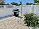 Backyard patio area with a modern grill, perfect for outdoor cooking and entertaining, fenced at 2605 Sunnybrook Dr, Sarasota, FL 34239