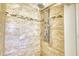Modern shower featuring beautiful tilework and a rainfall shower head, creating a spa-like experience at 2605 Sunnybrook Dr, Sarasota, FL 34239