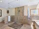 Modern bathroom with a walk-in shower, tile flooring, and spa-like amenities at 2720 Herwald St, Sarasota, FL 34231