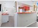 Efficient kitchen with a breakfast bar and open layout, seamlessly connecting to the dining and living areas at 2720 Herwald St, Sarasota, FL 34231