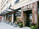 Exterior of Brick's Smoked Meats restaurant with outdoor seating at 2720 Herwald St, Sarasota, FL 34231