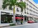 Exterior of Studio Chop restaurant with outdoor seating and red umbrellas at 2720 Herwald St, Sarasota, FL 34231