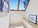 Bright sitting area featuring neutral earth tones, skylight, and bench seating at 2720 Herwald St, Sarasota, FL 34231