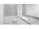 Bathroom featuring a bathtub, shower, and granite vanity at 27407 Deep Creek Blvd, Punta Gorda, FL 33983