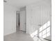 Bedroom with a closet and doorway to a walk-in laundry room at 27407 Deep Creek Blvd, Punta Gorda, FL 33983