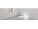 Bright bedroom with light-colored floors and a window that lets in natural light at 27407 Deep Creek Blvd, Punta Gorda, FL 33983