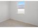 Bright bedroom with window view offers a serene and inviting space at 27407 Deep Creek Blvd, Punta Gorda, FL 33983